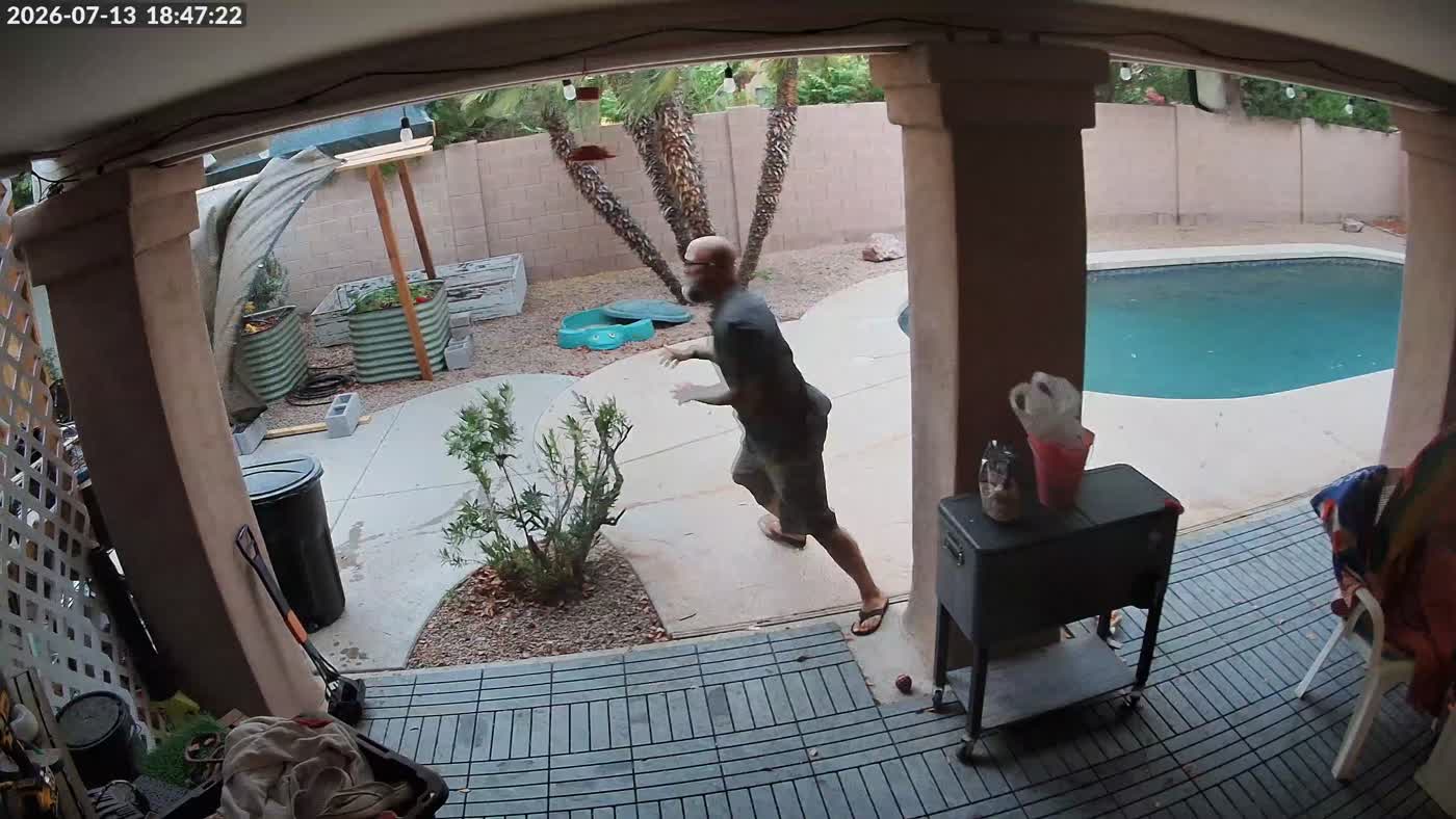 Security camera still of the backyard shade structure coming down during the storm